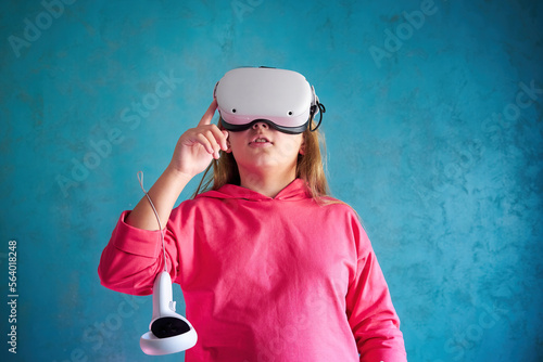 little girl playing with VR glasses
