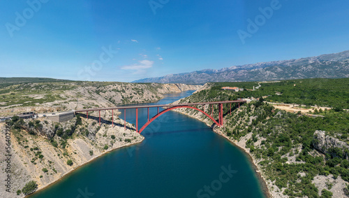 Maslenica Bridge Most in Croatia. The Maslenica Bridge is a deck arch bridge carrying the state road spanning the Novsko Zdrilo strait of the Adriatic Sea photo