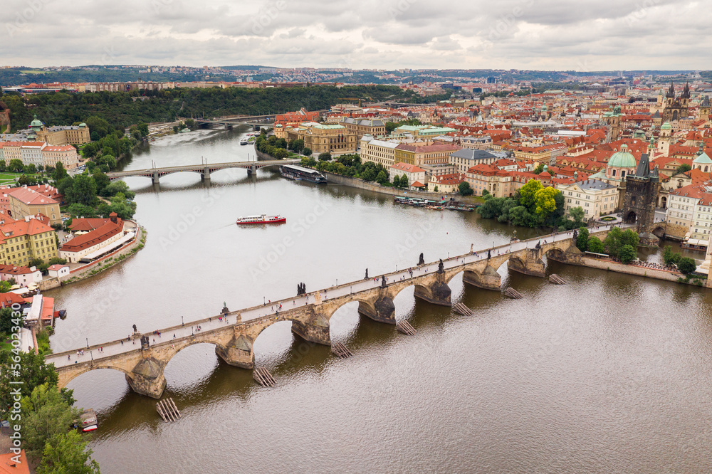 Obraz premium Prague Old Town in Czech Republic with Famous Sightseeing Places in Background. Charles Bridge Iconic 14th century Structure with View, Vltava river and Prague Cityscape. Must Visit City