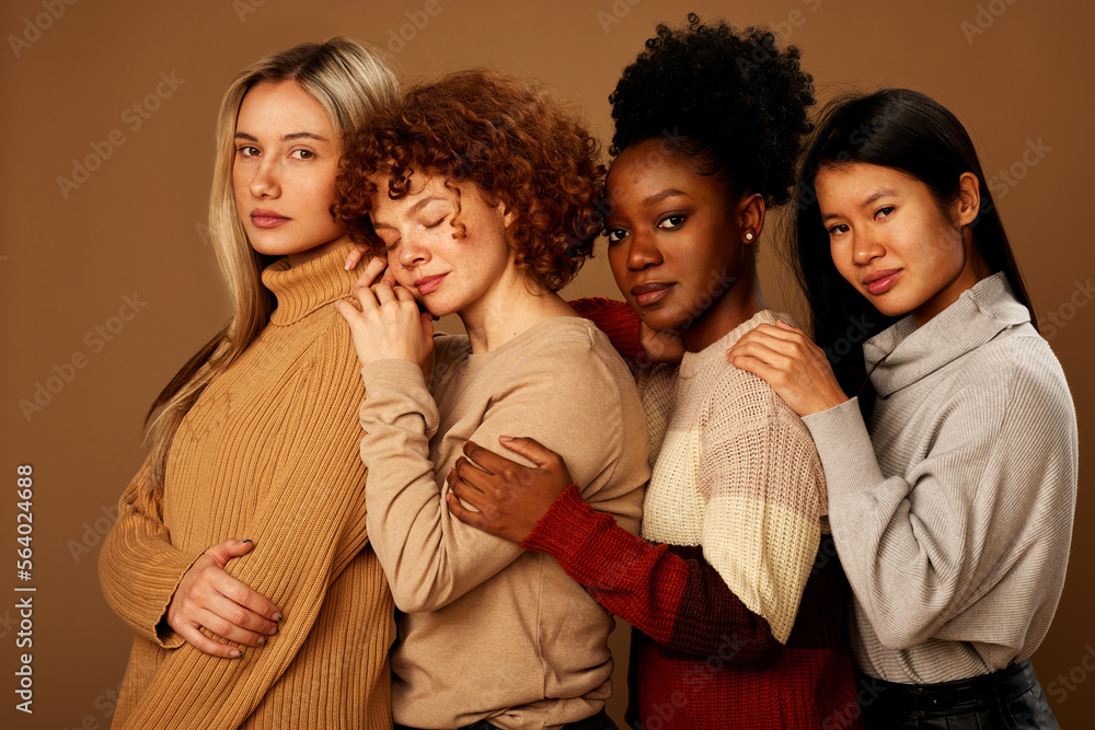 Studio shot of a multicultural beautiful girls with natural skin posing. Studio shot of a multicultural beautiful girls with natural skin posing.