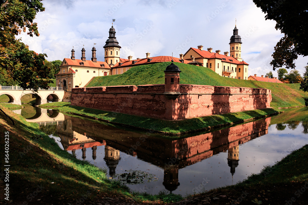 Nesvizh castle surrounded by water, clear sunny day. Belarus.