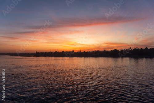 Sunset with some clouds on the Nile River © Montse