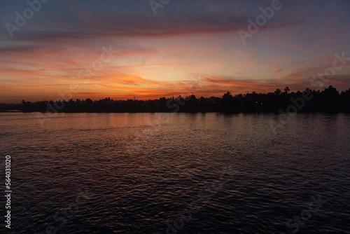 Sunset with some clouds on the Nile River © Montse