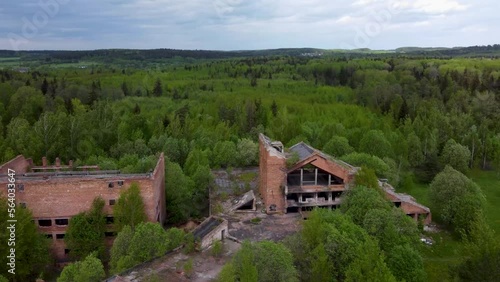 Aerial view of destoryed building in the middle of deep forest, chernobyl disaster, riuned hotel in chernobyl, abandoned building.
