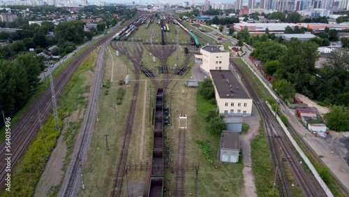 Drone timelaps view of train railway sorting station, carriages going downhill on theit own