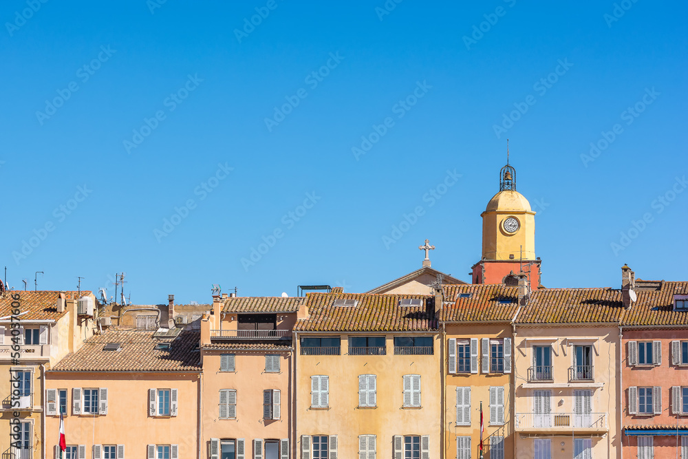 Postcard view of Saint Tropez village in south of France against clear blue summer sky
