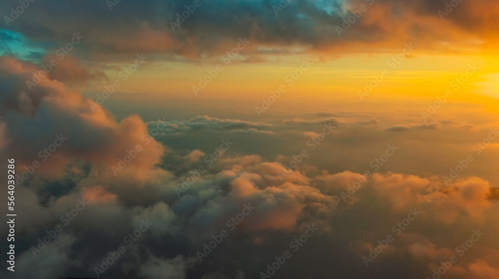 Clouds over sea in sunset colors