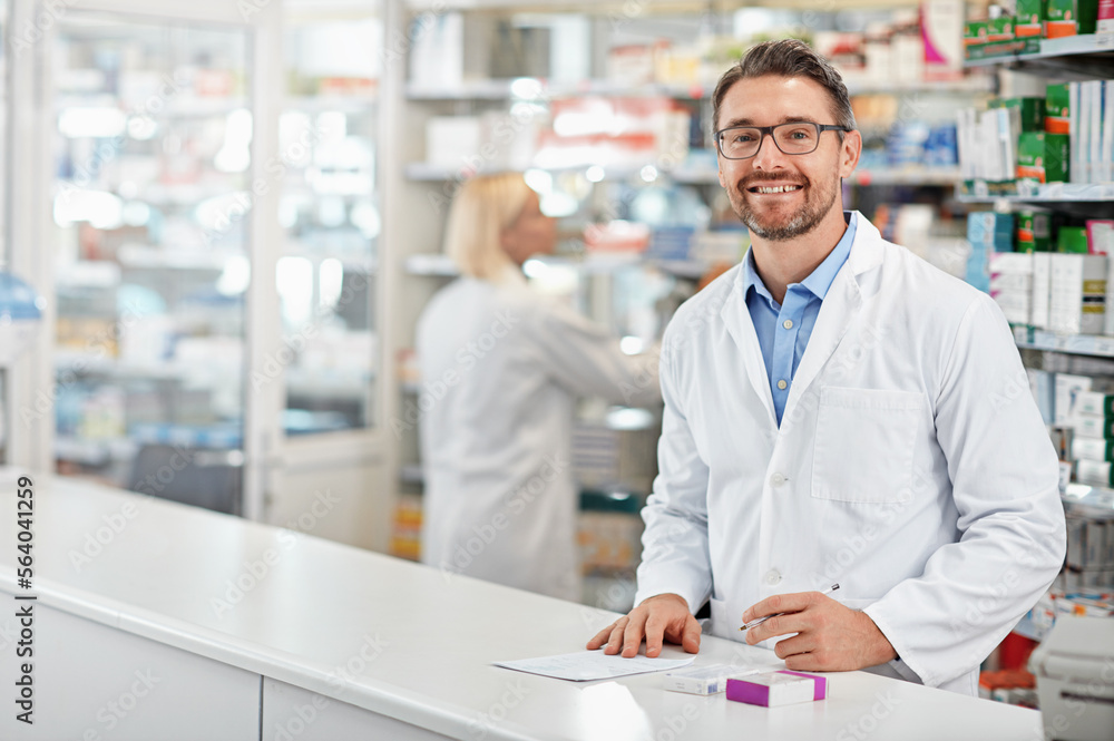 Portrait of happy pharmacist man with pharmacy services, medicine advice and product trust at shop, retail counter. Inventory, stock help desk and medical professional worker, person or doctor smile