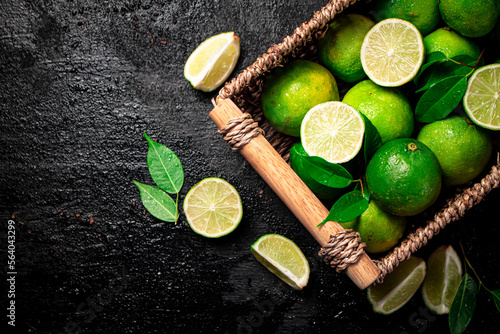 Lime with leaves in a basket. 