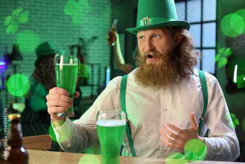 Bearded man with glass of b...