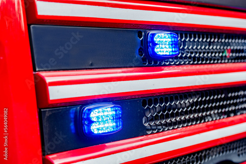 Emergency fire engine with blue lights flashing photo