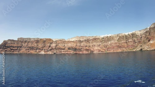 Panoramic view from the ship of Santorinis city of Fira hanging on the volcanic caldera at Santorini island in Aegean sea, Greece photo