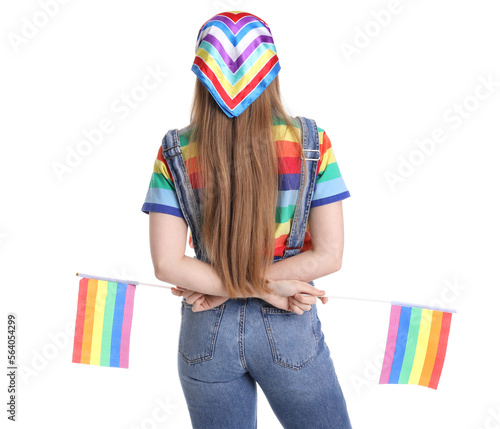 Young woman with LGBT flags on white background, back view