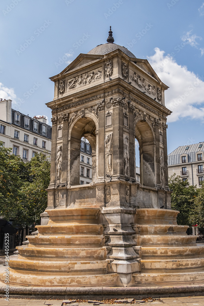 Obraz premium Fountain of the Innocents (Fontaine des Innocents, 1547 - 1550) at place Joachim-du-Bellay in Paris. Fountain of the Innocents is oldest monumental fountain in Paris, France.
