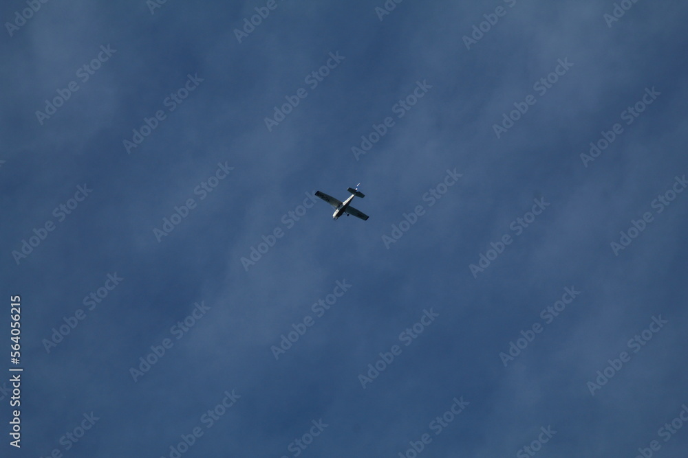 Flying plane on bright sky Flying plane on bright sky