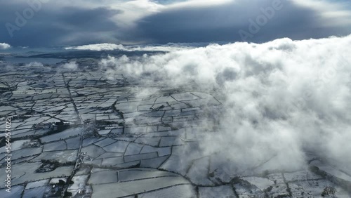 Aerial video of above freezing fog on a snowy Knockdhu Mountain County Antrim Northern Ireland photo