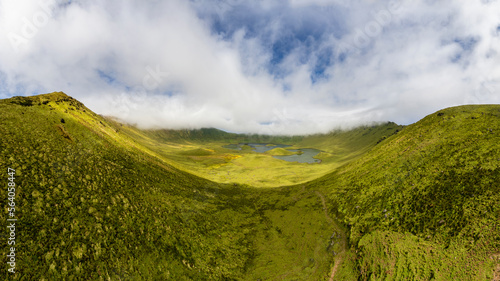 Natural landscape, panoramic view. Beautiful lagoon in the volcanic Caldeirao crater an at Corvo island, Azores, Portugal. Nature and science in this amasing tavel destination.