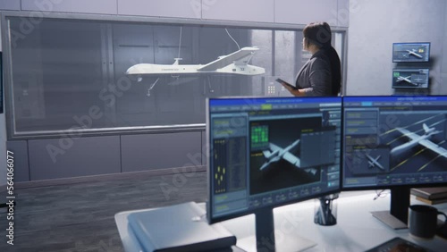 Engineers check aerodynamics of new development drone in laboratory for modern modifications using wind tunnel with steam. Computer system for changing parameters. Concept of manufacturing UCAVs.