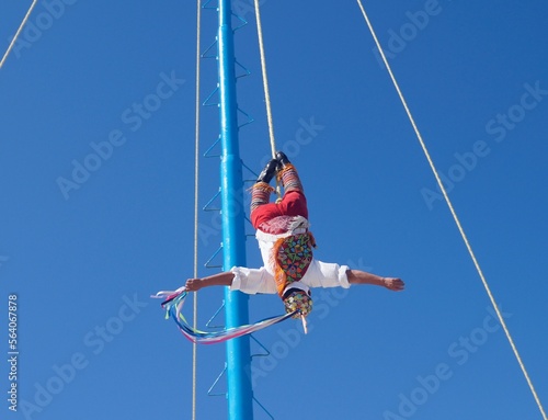 man dangling by feet in mexico