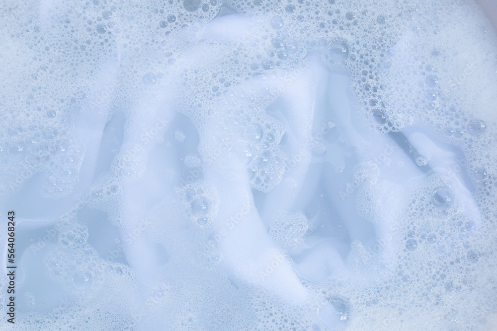 Obraz premium Top view of towel soak in powder detergent water dissolution. Laundry concept