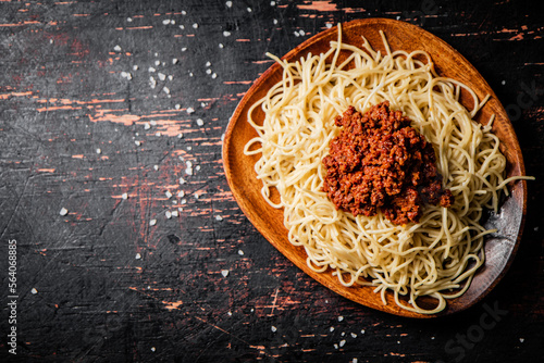 Homemade spaghetti bolognese in a plate on the table. 