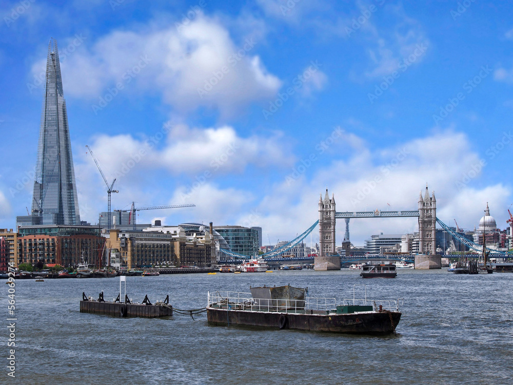 Barge in the Thames River in London, looking west toward Tower Bridge Barge in the Thames River in London, looking west toward Tower Bridge