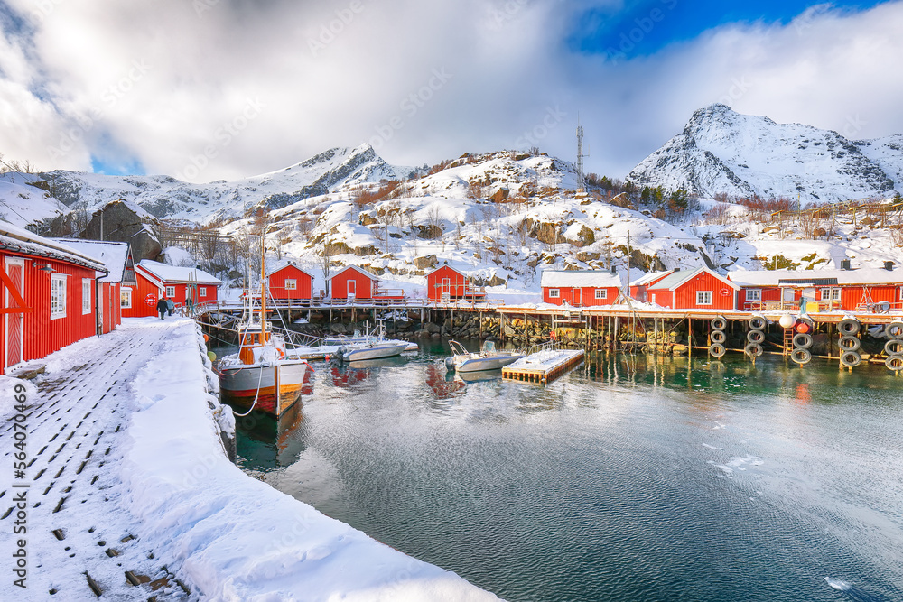 Amazing morning seascape of Norwegian sea and cityscape of Nusfjord village.