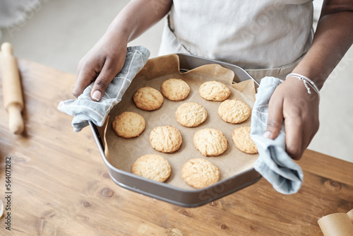 Girl holding tray with homemade cookies