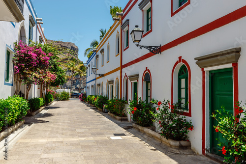 historic center of puerto de mogan with lots of bougainvillea flowers  Canary Island