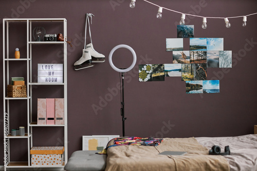 Teenagers room interior with hobbie items on maroon wall photo