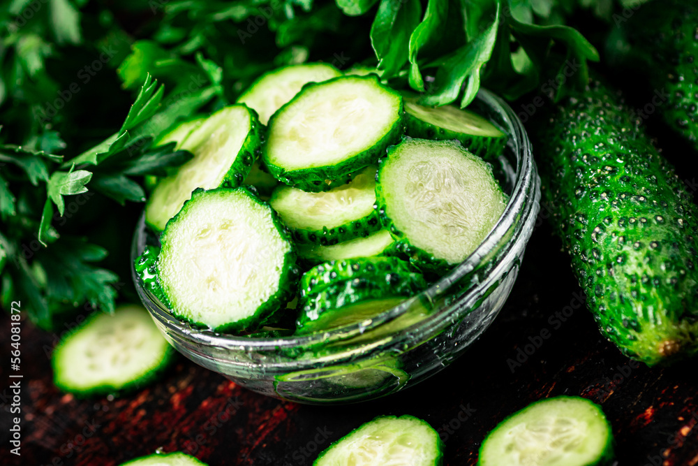 Sliced and whole cucumbers on the table. Sliced and whole cucumbers on the table.