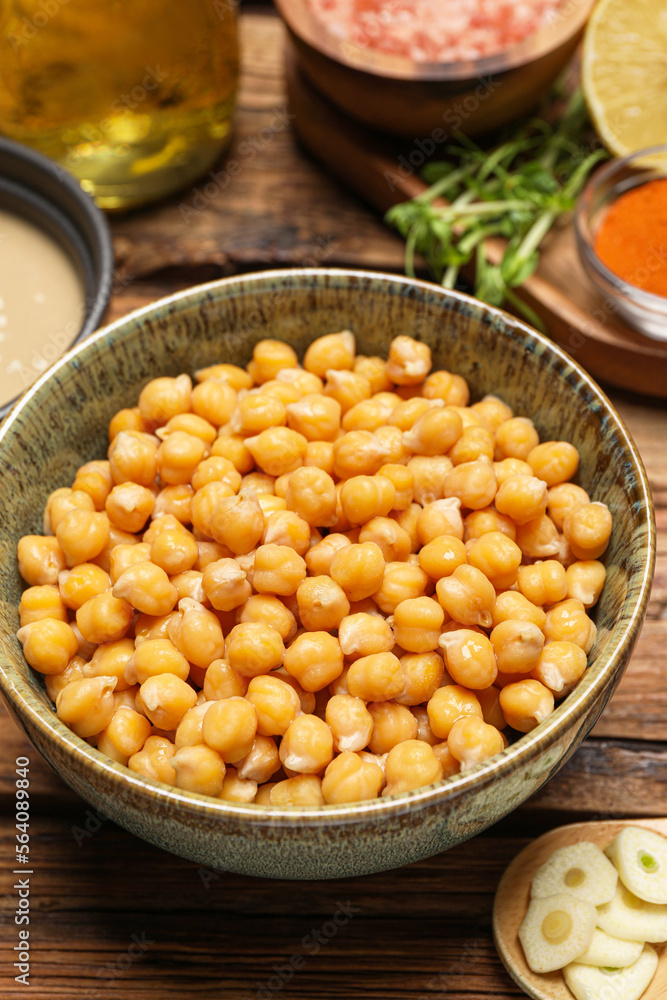 Delicious chickpeas on wooden table, closeup. Hummus ingredient Delicious chickpeas on wooden table, closeup. Hummus ingredient