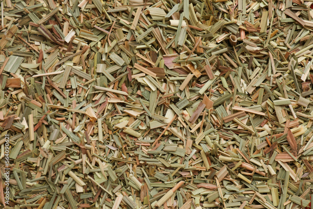 Aromatic dried lemongrass as background, top view Aromatic dried lemongrass as background, top view