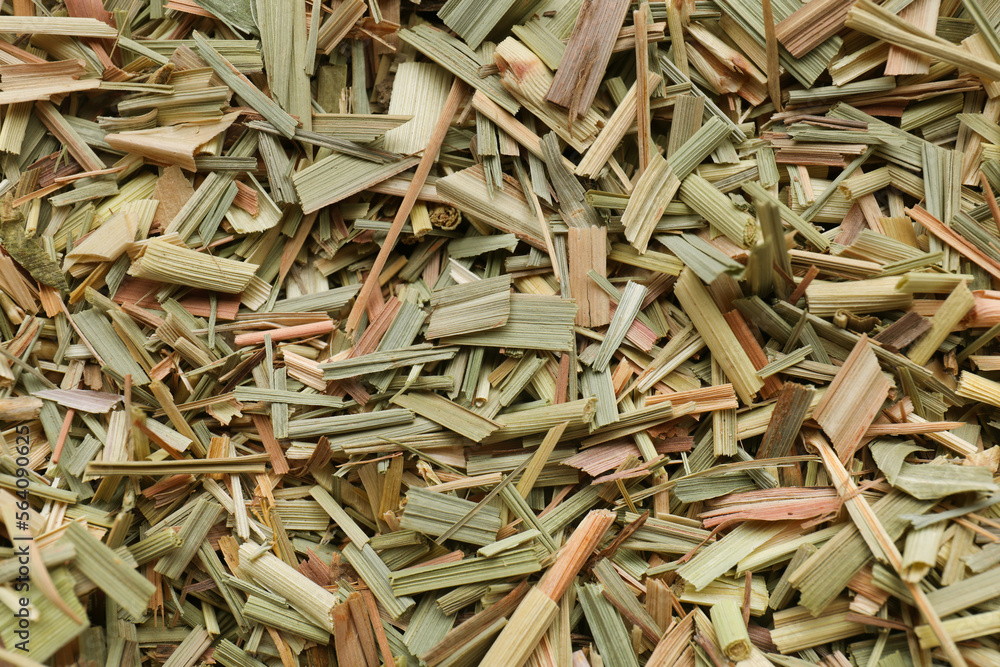 Aromatic dried lemongrass as background, top view