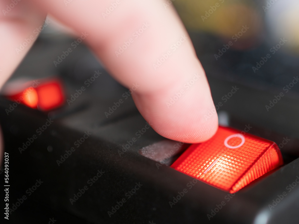 Illuminated power switch on a sockets a symbol for power consumption