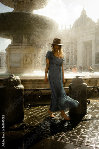 Photography Woman at the fountain of St. Peter's Square