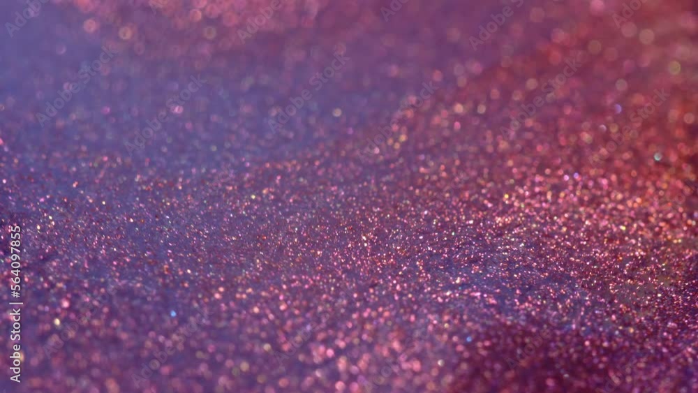 High Shimmering Pigments. Liquid with glitter macro . Pink purple metallic copper. Magical holographic glow and bokeh. Festive abstract background High Shimmering Pigments. Liquid with glitter macro . Pink purple metallic copper. Magical holographic glow and bokeh. Festive abstract background