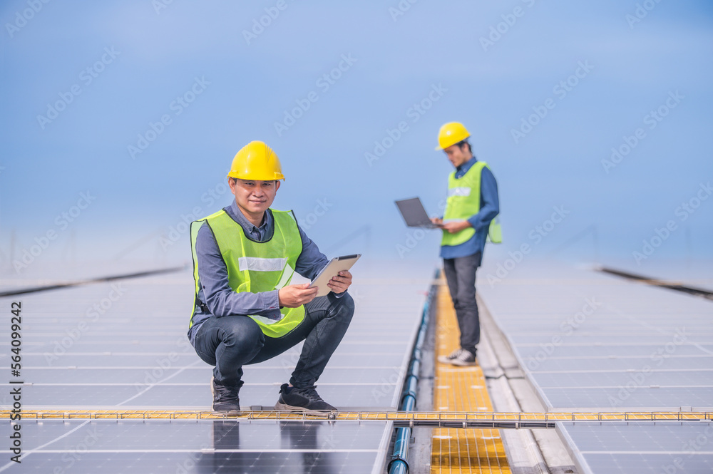 Team professional engineer working at solar power station Team professional engineer working at solar power station