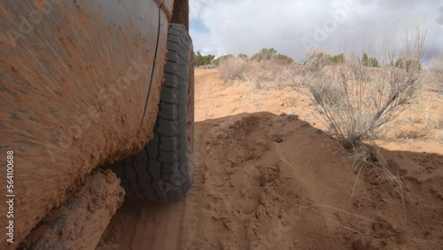 4x4 off-road truck on sandy desert trail in southwest desert. 