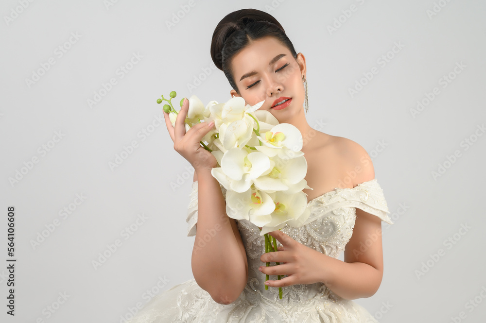 Young asian beautiful bride smile with happy on white background Young asian beautiful bride smile with happy on white background