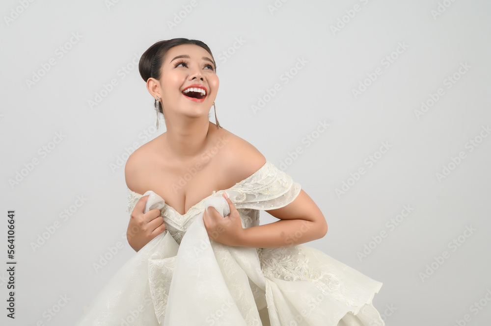 Young asian beautiful bride pose with excited feel on white background Young asian beautiful bride pose with excited feel on white background