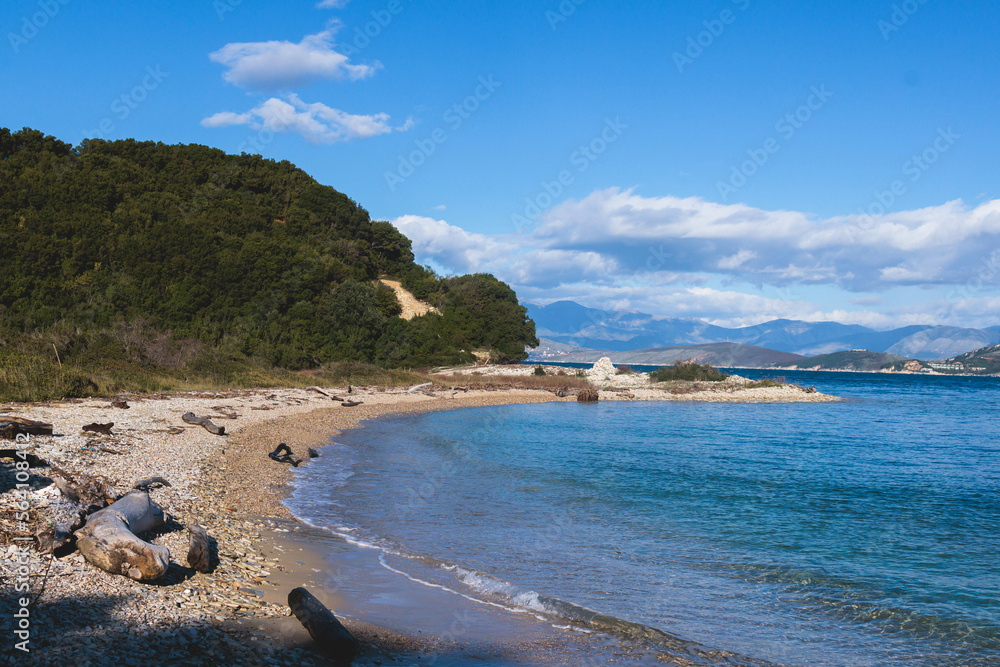 View of Erimitis coast landscape near Kassiopi and Agios Stefanos village, Corfu island, Kerkyra, Greece, with hiking trail path, forest and beach in a summer sunny day
