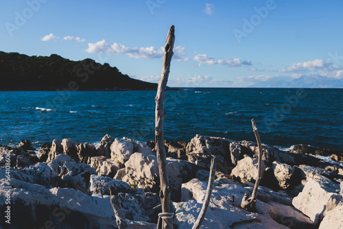 View of Erimitis coast landscape near Kassiopi and Agios Stefanos village, Corfu island, Kerkyra, Greece, with hiking trail path, forest and beach in a summer sunny day photo