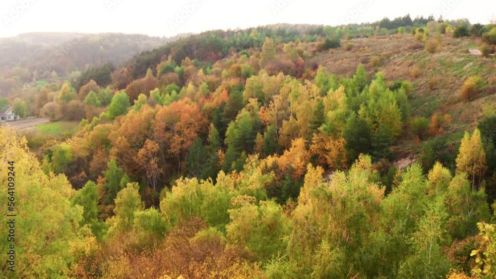 Aerial view of fall foliage in picturesque countryside. Beautiful travel destination of lush, vibrant forest with colorful leaves as seen from above. High quality 4k footage Aerial view of fall foliage in picturesque countryside. Beautiful travel destination of lush, vibrant forest with colorful leaves as seen from above. High quality 4k footage