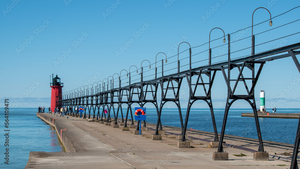 An iron catwalk leads to the South Haven lighthouse at the end of the pier, on Lake Michigan.