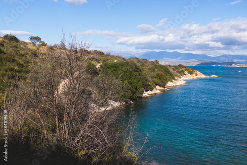 View of Erimitis coast landscape near Kassiopi and Agios Stefanos village, Corfu island, Kerkyra, Greece, with hiking trail path, forest and beach in a summer sunny day