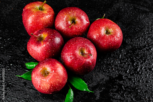 Ripe red apples with foliage. 