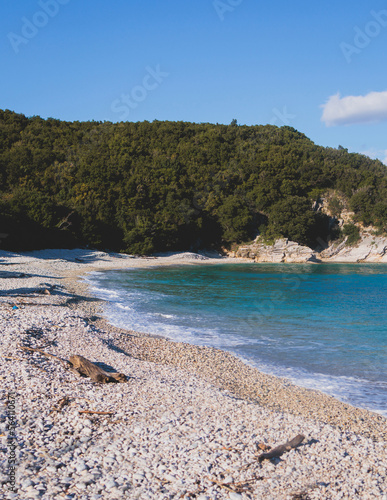 View of Erimitis coast landscape near Kassiopi and Agios Stefanos village, Corfu island, Kerkyra, Greece, with hiking trail path, forest and beach in a summer sunny day photo