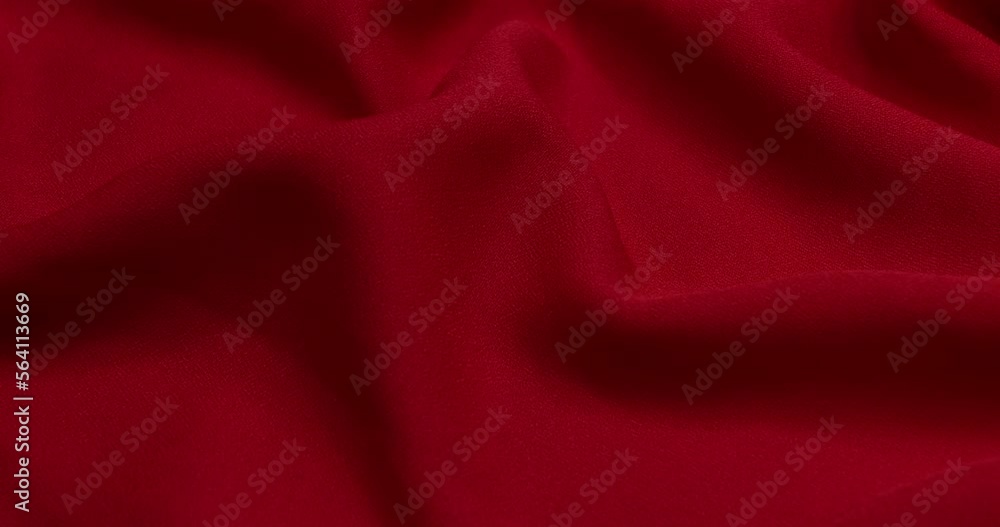 Red fabric background. Red cloth waves background texture. Red fabric cloth textile material.