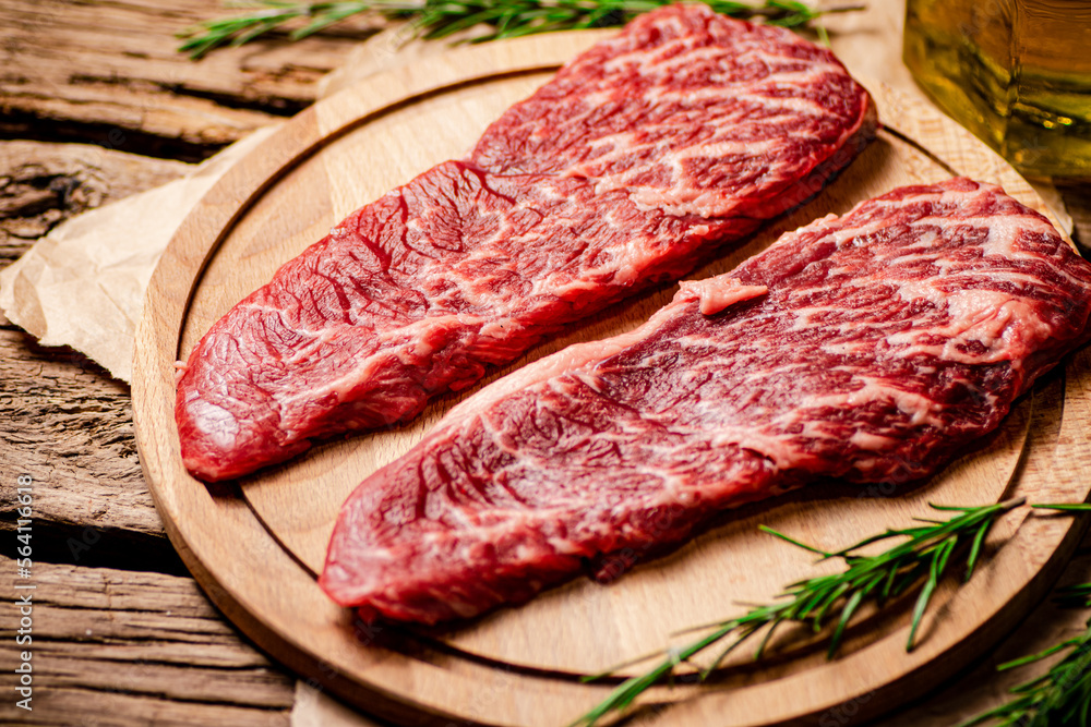 Raw steak on a cutting board. 